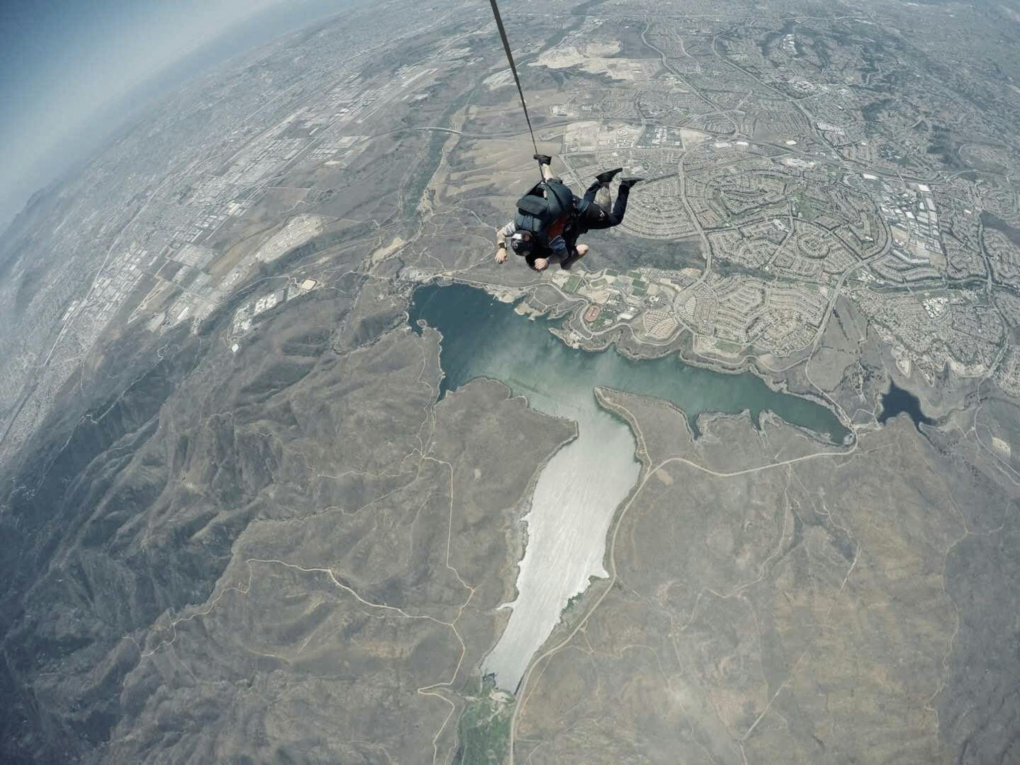 Exhilarating tandem skydive with stunning aerial views of landscape.